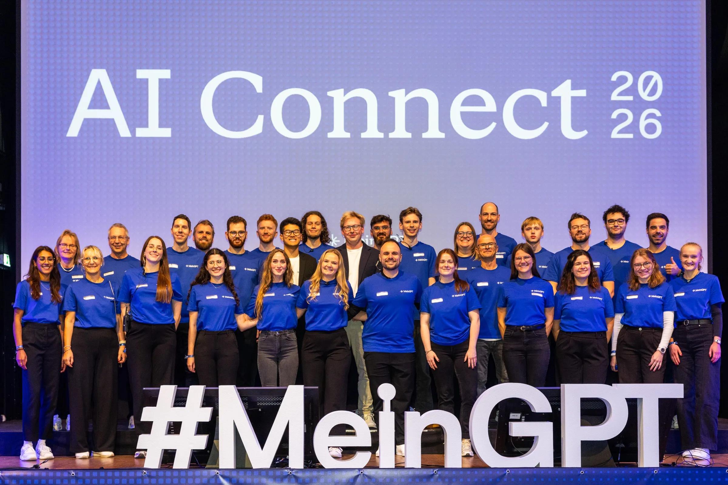 The MeinGPT team on stage at AI Connect 2026 in the Löwenbräukeller